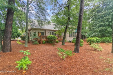 This beautiful home, across from a pretty pond, is located along on Lockwood Folly Country Club in North Carolina - for sale on GolfHomes.com, golf home, golf lot
