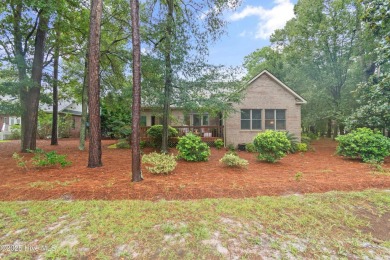 This beautiful home, across from a pretty pond, is located along on Lockwood Folly Country Club in North Carolina - for sale on GolfHomes.com, golf home, golf lot