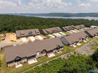 Located in Gunter's Landing Golf Club, this lake view villa on Gunters Landing in Alabama - for sale on GolfHomes.com, golf home, golf lot