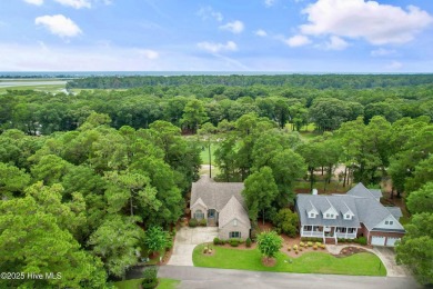 This beautiful home, across from a pretty pond, is located along on Lockwood Folly Country Club in North Carolina - for sale on GolfHomes.com, golf home, golf lot
