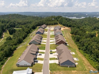 Located in Gunter's Landing Golf Club, this lake view villa on Gunters Landing in Alabama - for sale on GolfHomes.com, golf home, golf lot
