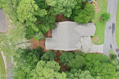 This beautiful home, across from a pretty pond, is located along on Lockwood Folly Country Club in North Carolina - for sale on GolfHomes.com, golf home, golf lot