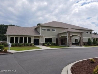 This beautiful home, across from a pretty pond, is located along on Lockwood Folly Country Club in North Carolina - for sale on GolfHomes.com, golf home, golf lot