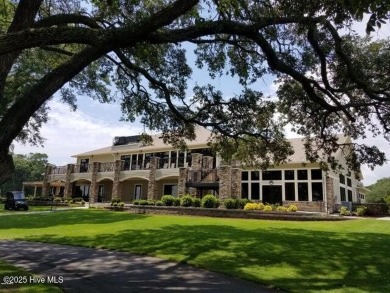 This beautiful home, across from a pretty pond, is located along on Lockwood Folly Country Club in North Carolina - for sale on GolfHomes.com, golf home, golf lot