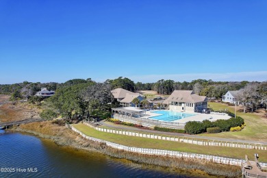 This beautiful home, across from a pretty pond, is located along on Lockwood Folly Country Club in North Carolina - for sale on GolfHomes.com, golf home, golf lot