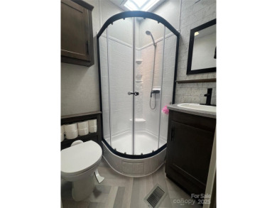 Start Lake Life Today! This 2021 spacious camper 12'x30' covered on Old North State Club at Uwharrie Point Golf community in North Carolina - for sale on GolfHomes.com, golf home, golf lot