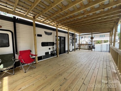 Start Lake Life Today! This 2021 spacious camper 12'x30' covered on Old North State Club at Uwharrie Point Golf community in North Carolina - for sale on GolfHomes.com, golf home, golf lot