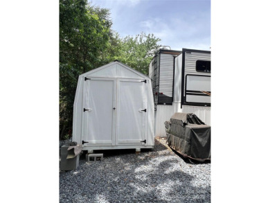 Start Lake Life Today! This 2021 spacious camper 12'x30' covered on Old North State Club at Uwharrie Point Golf community in North Carolina - for sale on GolfHomes.com, golf home, golf lot