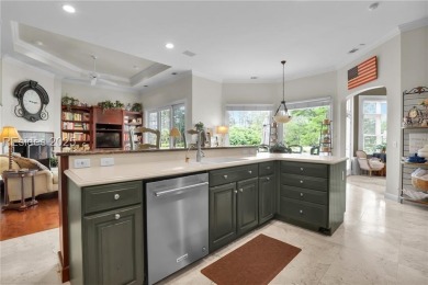 Enjoy tranquil lagoon views and a front-row seat to the 8th on Wexford Golf Club in South Carolina - for sale on GolfHomes.com, golf home, golf lot
