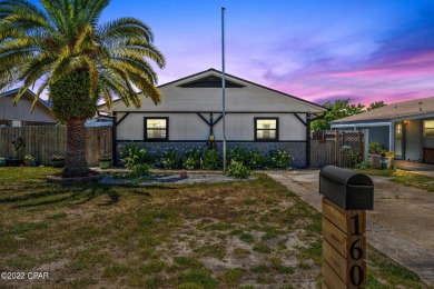 This adorable but spacious beach cottage is tastefully remodeled on Holiday Golf Club - Regulation in Florida - for sale on GolfHomes.com, golf home, golf lot