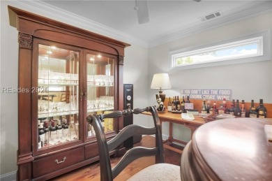 Enjoy tranquil lagoon views and a front-row seat to the 8th on Wexford Golf Club in South Carolina - for sale on GolfHomes.com, golf home, golf lot