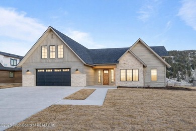 Immerse yourself in the best of Teton Valley living with this on Teton Reserve in Idaho - for sale on GolfHomes.com, golf home, golf lot