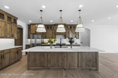 Immerse yourself in the best of Teton Valley living with this on Teton Reserve in Idaho - for sale on GolfHomes.com, golf home, golf lot