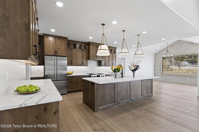 Immerse yourself in the best of Teton Valley living with this on Teton Reserve in Idaho - for sale on GolfHomes.com, golf home, golf lot