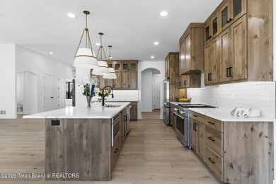 Immerse yourself in the best of Teton Valley living with this on Teton Reserve in Idaho - for sale on GolfHomes.com, golf home, golf lot