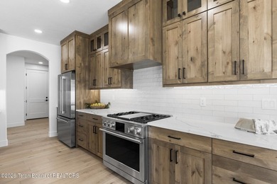 Immerse yourself in the best of Teton Valley living with this on Teton Reserve in Idaho - for sale on GolfHomes.com, golf home, golf lot