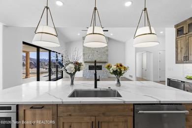 Immerse yourself in the best of Teton Valley living with this on Teton Reserve in Idaho - for sale on GolfHomes.com, golf home, golf lot