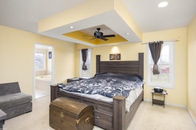 This 5 bedroom home located in a tranquil setting on over 1.5 on Springfield Oaks Golf Course in Michigan - for sale on GolfHomes.com, golf home, golf lot