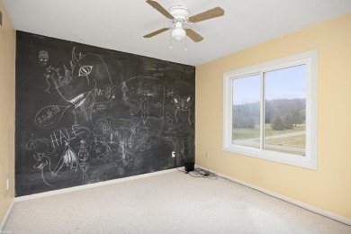 This 5 bedroom home located in a tranquil setting on over 1.5 on Springfield Oaks Golf Course in Michigan - for sale on GolfHomes.com, golf home, golf lot