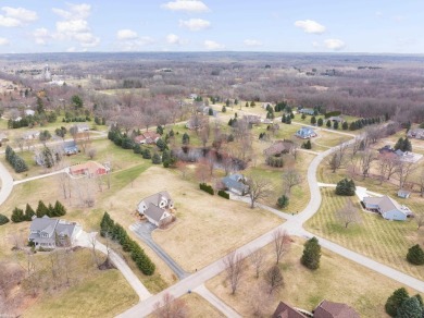 This 5 bedroom home located in a tranquil setting on over 1.5 on Springfield Oaks Golf Course in Michigan - for sale on GolfHomes.com, golf home, golf lot