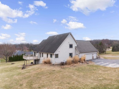 This 5 bedroom home located in a tranquil setting on over 1.5 on Springfield Oaks Golf Course in Michigan - for sale on GolfHomes.com, golf home, golf lot