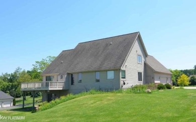 This 5 bedroom home located in a tranquil setting on over 1.5 on Springfield Oaks Golf Course in Michigan - for sale on GolfHomes.com, golf home, golf lot