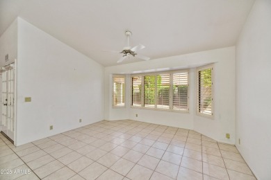 This Camelback model with vaulted ceilings and enclosed patio on Westbrook Village Golf Club in Arizona - for sale on GolfHomes.com, golf home, golf lot