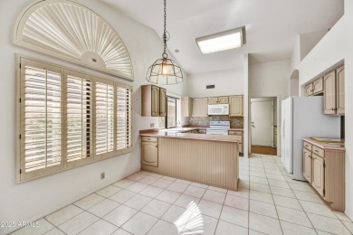 This Camelback model with vaulted ceilings and enclosed patio on Westbrook Village Golf Club in Arizona - for sale on GolfHomes.com, golf home, golf lot