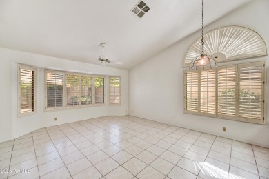 This Camelback model with vaulted ceilings and enclosed patio on Westbrook Village Golf Club in Arizona - for sale on GolfHomes.com, golf home, golf lot