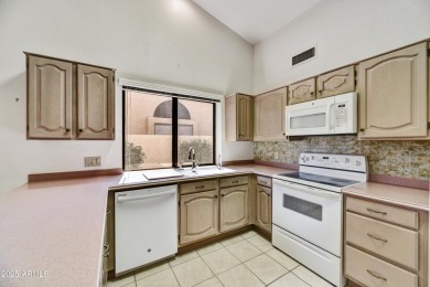 This Camelback model with vaulted ceilings and enclosed patio on Westbrook Village Golf Club in Arizona - for sale on GolfHomes.com, golf home, golf lot