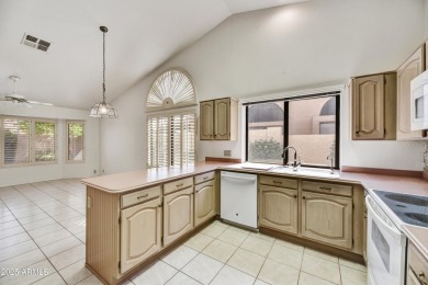 This Camelback model with vaulted ceilings and enclosed patio on Westbrook Village Golf Club in Arizona - for sale on GolfHomes.com, golf home, golf lot