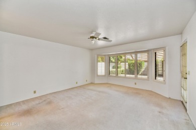 This Camelback model with vaulted ceilings and enclosed patio on Westbrook Village Golf Club in Arizona - for sale on GolfHomes.com, golf home, golf lot