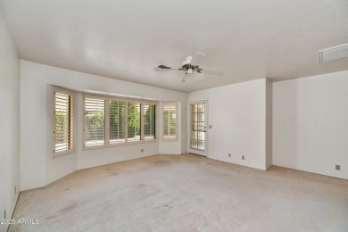 This Camelback model with vaulted ceilings and enclosed patio on Westbrook Village Golf Club in Arizona - for sale on GolfHomes.com, golf home, golf lot
