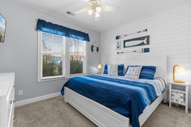 This charming 2-bedroom, 2-bath beach bungalow is one you'll on Barefoot Resort and Golf Club  in South Carolina - for sale on GolfHomes.com, golf home, golf lot