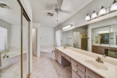 This Camelback model with vaulted ceilings and enclosed patio on Westbrook Village Golf Club in Arizona - for sale on GolfHomes.com, golf home, golf lot
