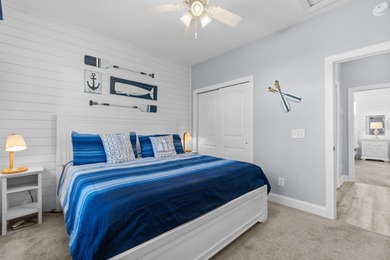 This charming 2-bedroom, 2-bath beach bungalow is one you'll on Barefoot Resort and Golf Club  in South Carolina - for sale on GolfHomes.com, golf home, golf lot