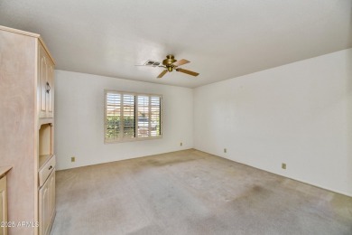 This Camelback model with vaulted ceilings and enclosed patio on Westbrook Village Golf Club in Arizona - for sale on GolfHomes.com, golf home, golf lot