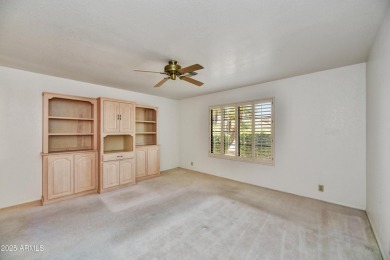 This Camelback model with vaulted ceilings and enclosed patio on Westbrook Village Golf Club in Arizona - for sale on GolfHomes.com, golf home, golf lot