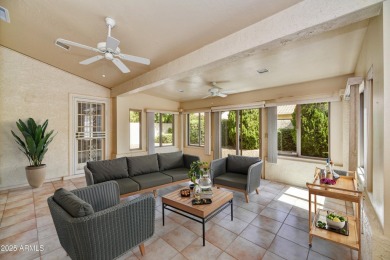 This Camelback model with vaulted ceilings and enclosed patio on Westbrook Village Golf Club in Arizona - for sale on GolfHomes.com, golf home, golf lot
