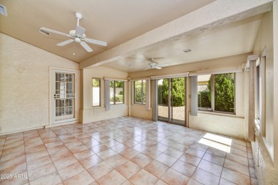 This Camelback model with vaulted ceilings and enclosed patio on Westbrook Village Golf Club in Arizona - for sale on GolfHomes.com, golf home, golf lot
