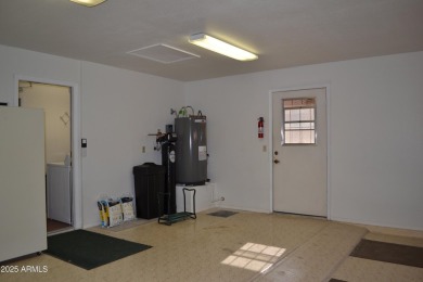 This Camelback model with vaulted ceilings and enclosed patio on Westbrook Village Golf Club in Arizona - for sale on GolfHomes.com, golf home, golf lot