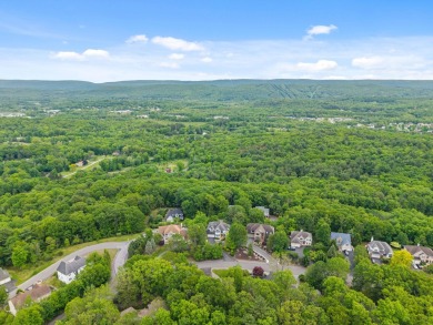 This impeccably maintained 3-bedroom, 4-bathroom contemporary on Country Club of the Poconos Golf Course in Pennsylvania - for sale on GolfHomes.com, golf home, golf lot