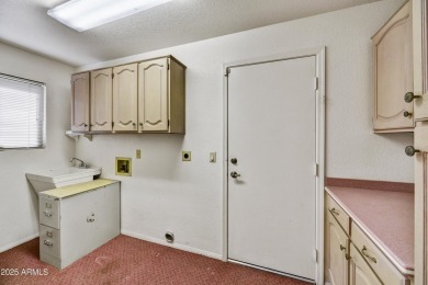 This Camelback model with vaulted ceilings and enclosed patio on Westbrook Village Golf Club in Arizona - for sale on GolfHomes.com, golf home, golf lot