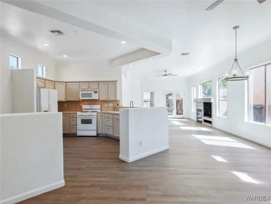 Experience the perfect blend of modern comfort and resort-style on Laughlin Ranch Golf Club in Arizona - for sale on GolfHomes.com, golf home, golf lot