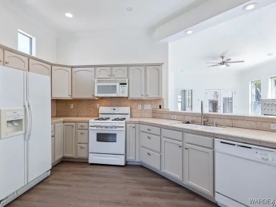 Experience the perfect blend of modern comfort and resort-style on Laughlin Ranch Golf Club in Arizona - for sale on GolfHomes.com, golf home, golf lot