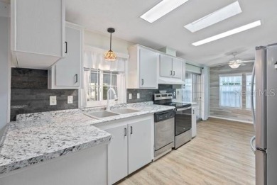 What an awesome home with an Island vibe.   TRIPLE WIDE 3 on Fairway Village Golf Course in Florida - for sale on GolfHomes.com, golf home, golf lot