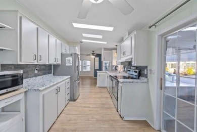 What an awesome home with an Island vibe.   TRIPLE WIDE 3 on Fairway Village Golf Course in Florida - for sale on GolfHomes.com, golf home, golf lot