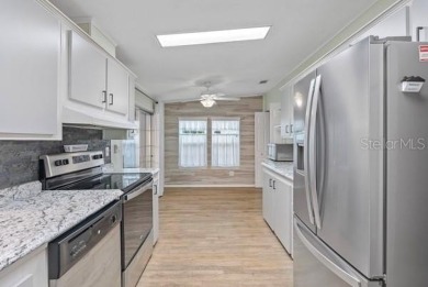 What an awesome home with an Island vibe.   TRIPLE WIDE 3 on Fairway Village Golf Course in Florida - for sale on GolfHomes.com, golf home, golf lot