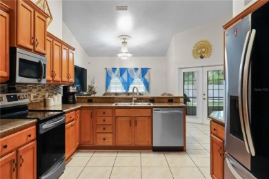 This beautifully designed concrete block stucco home stands out on The Grand Club Cypress Course in Florida - for sale on GolfHomes.com, golf home, golf lot