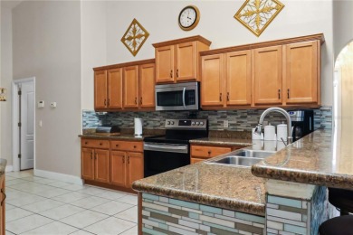 This beautifully designed concrete block stucco home stands out on The Grand Club Cypress Course in Florida - for sale on GolfHomes.com, golf home, golf lot